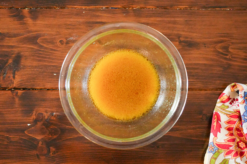dressing in a glass bowl for salsa.