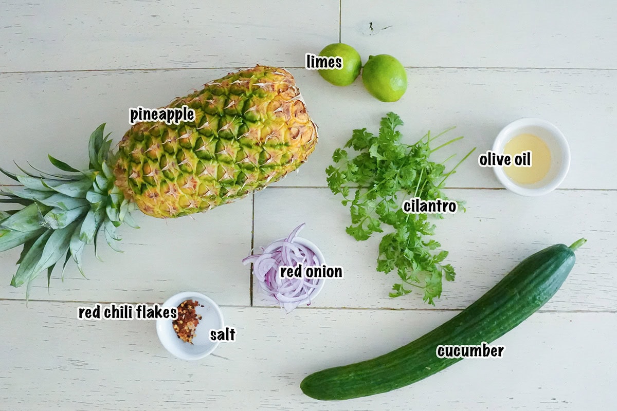 Ingredients for a cucumber and pineapple salad recipe.