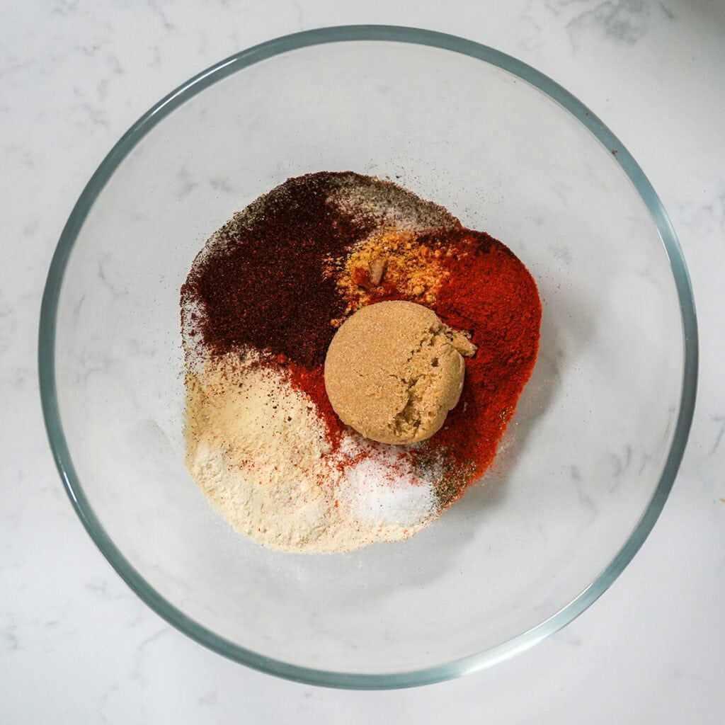 spices separated in a glass bowl.