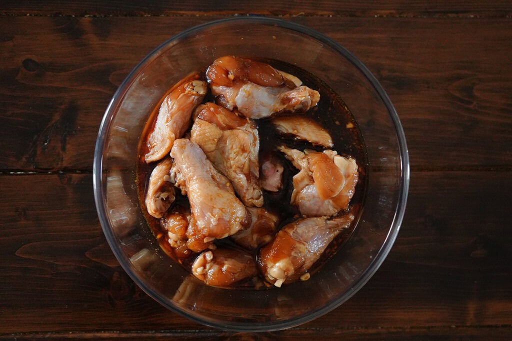 chicken marinating in a teriyaki soy sauce glaze.