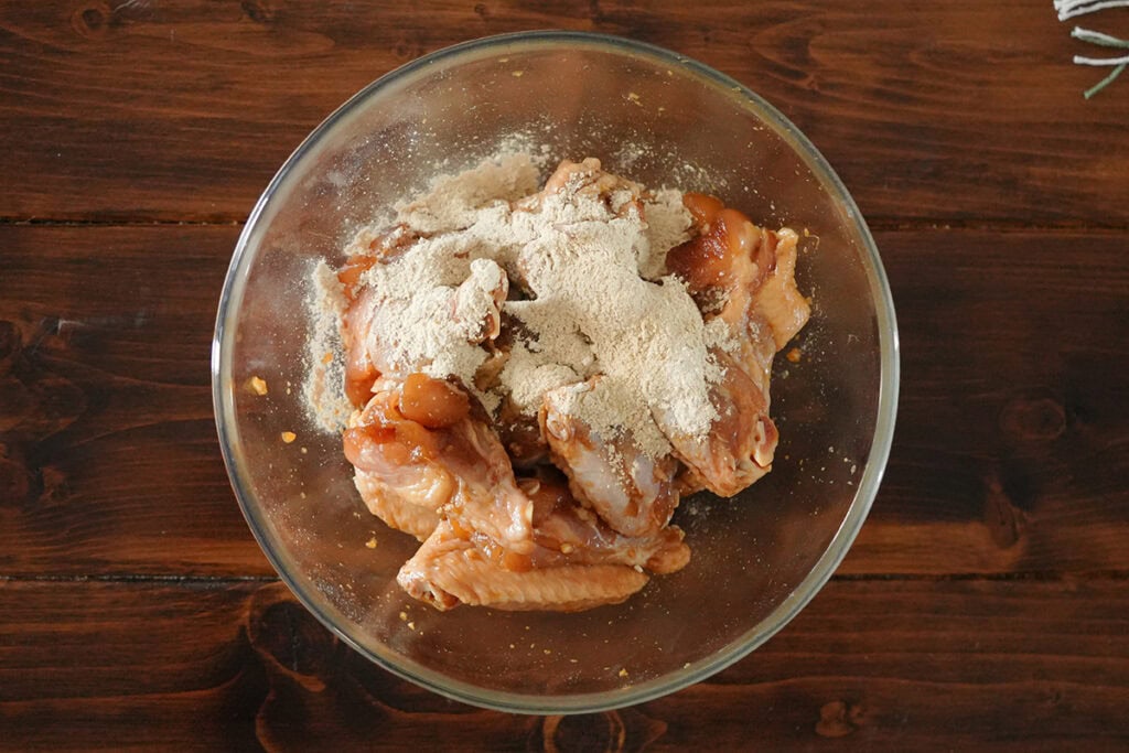 chicken wings coated in seasonings.