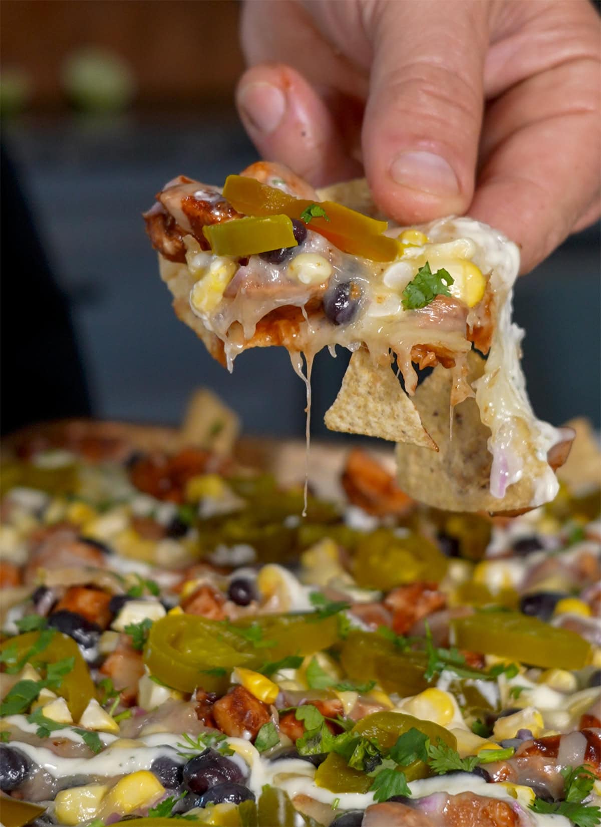 Nacho chips loaded with bbq chicken, jalapeño, cilantro and corn.