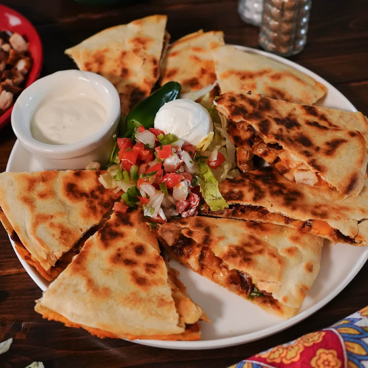 a quesadilla with chicken bacon and ranch.
