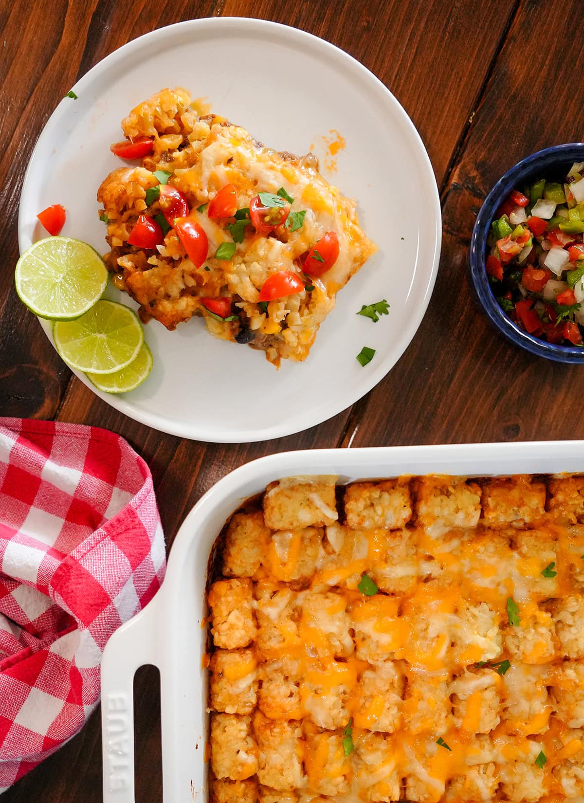 taco tater tot casserole with salsa and cheese.
