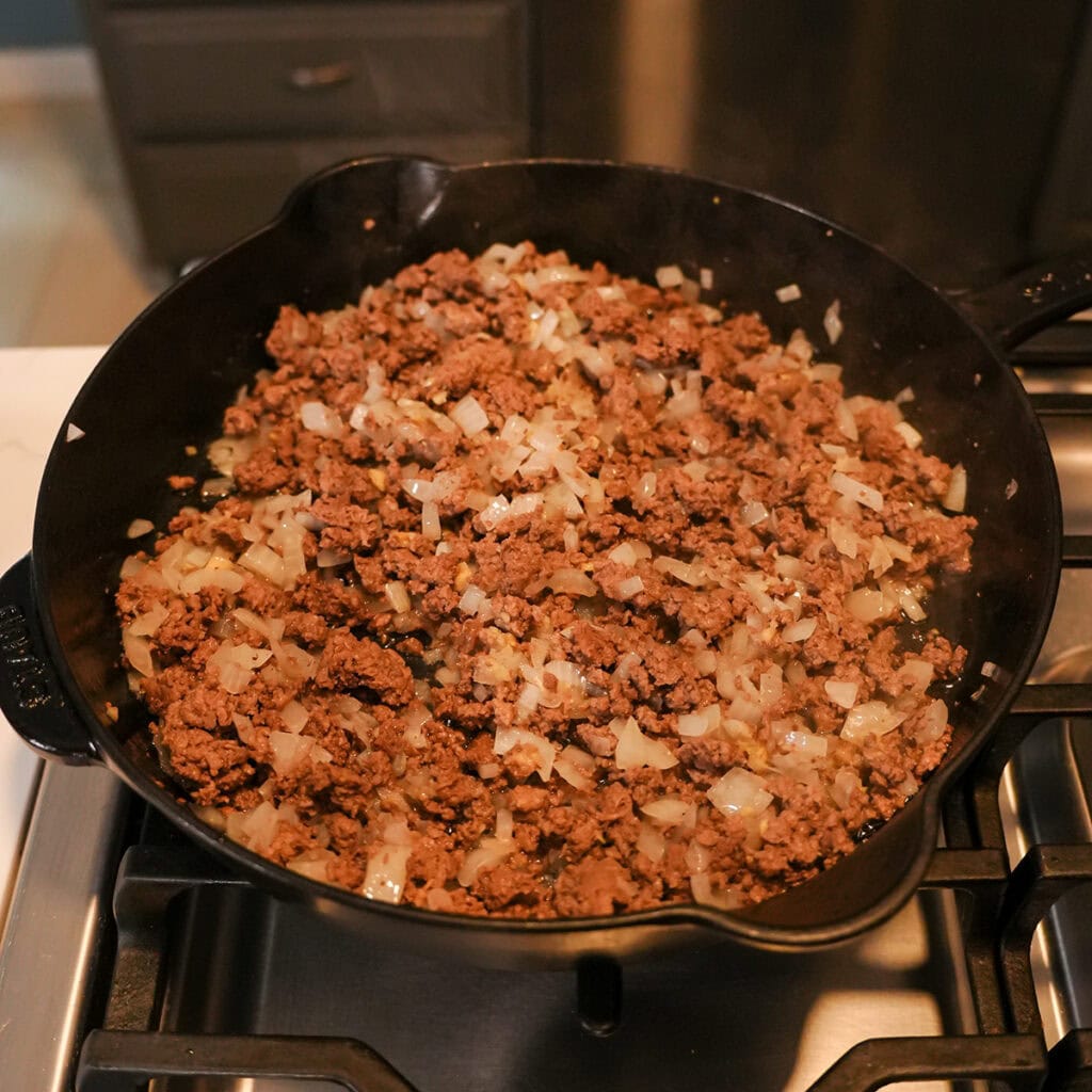 beef and onions in a skillet.