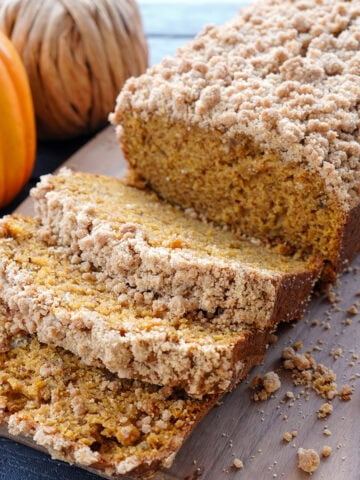 slices of pumpkin banana bread with a crumble.