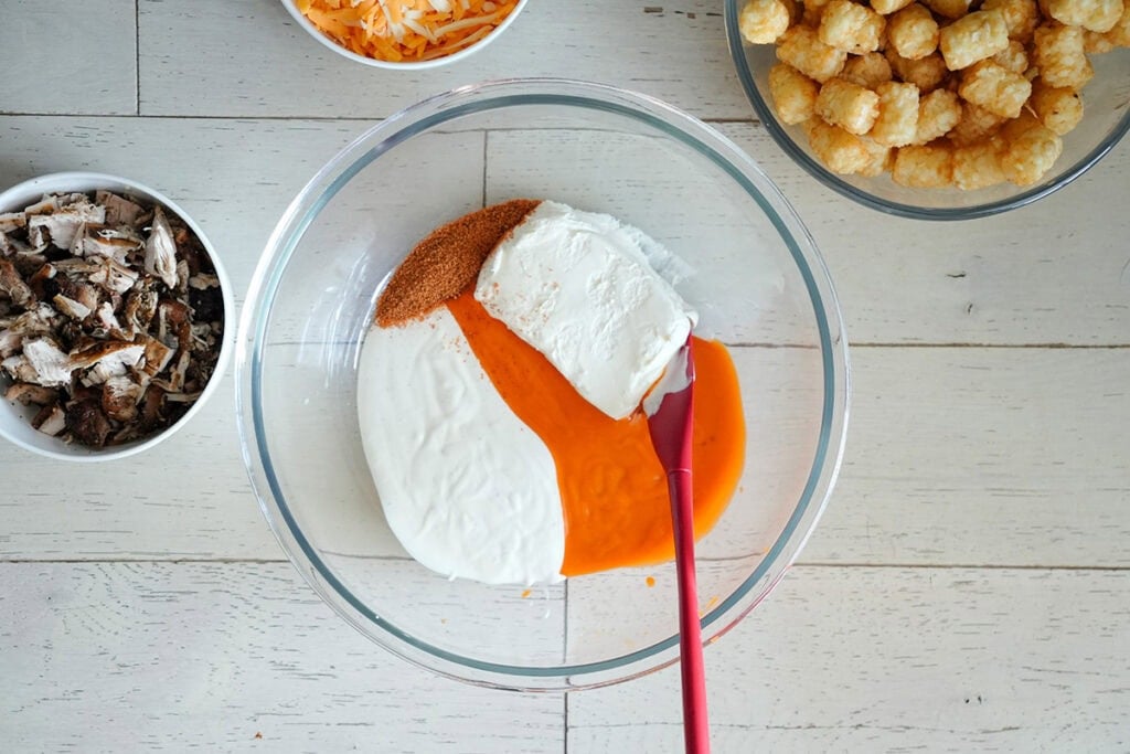 buffalo sauce and wet ingredients in a mixing bowl.