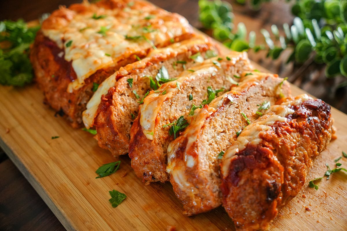 Meatloaf made with ground chicken topped with marinara and cheese.