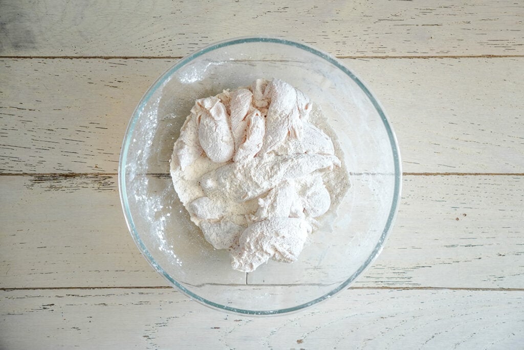 chicken tossed in flour, cornstarch and seasonings.