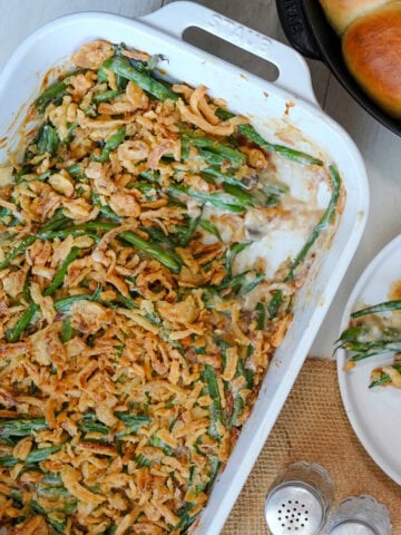 Green bean casserole with a crunchy fried onion topping.