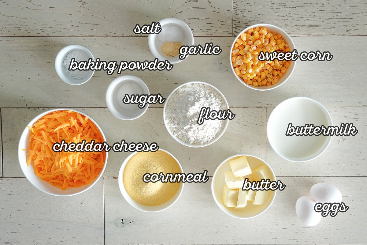 labeled ingredients for making a cheesy cornbread.
