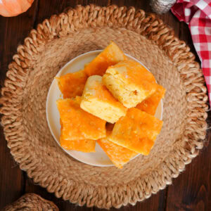 slices of cheesy cornbread on a plate.