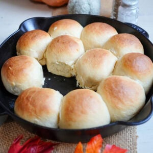 Easy yeast rolls in a skillet with butter.