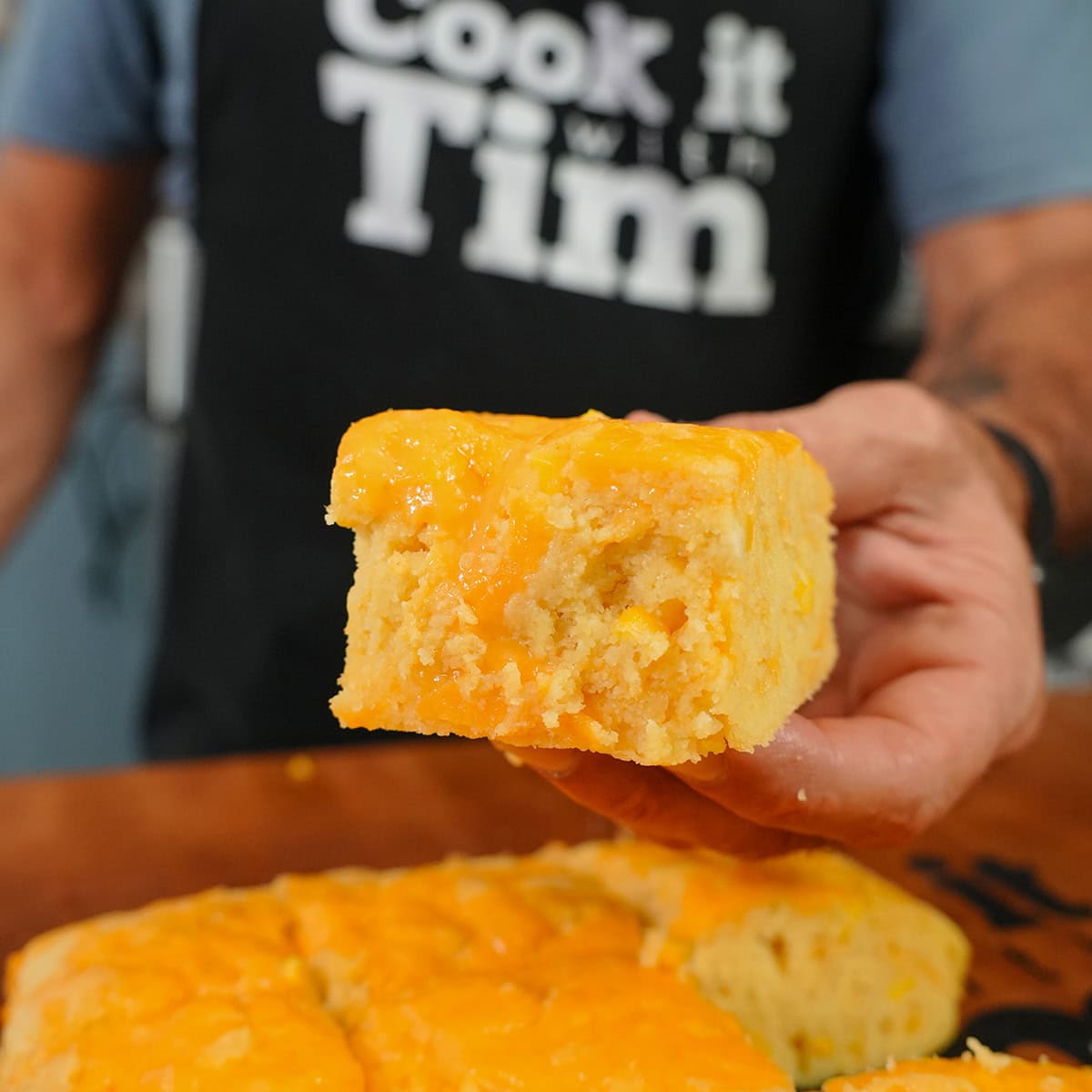 a fluffy moist square of cornbread with cheese.