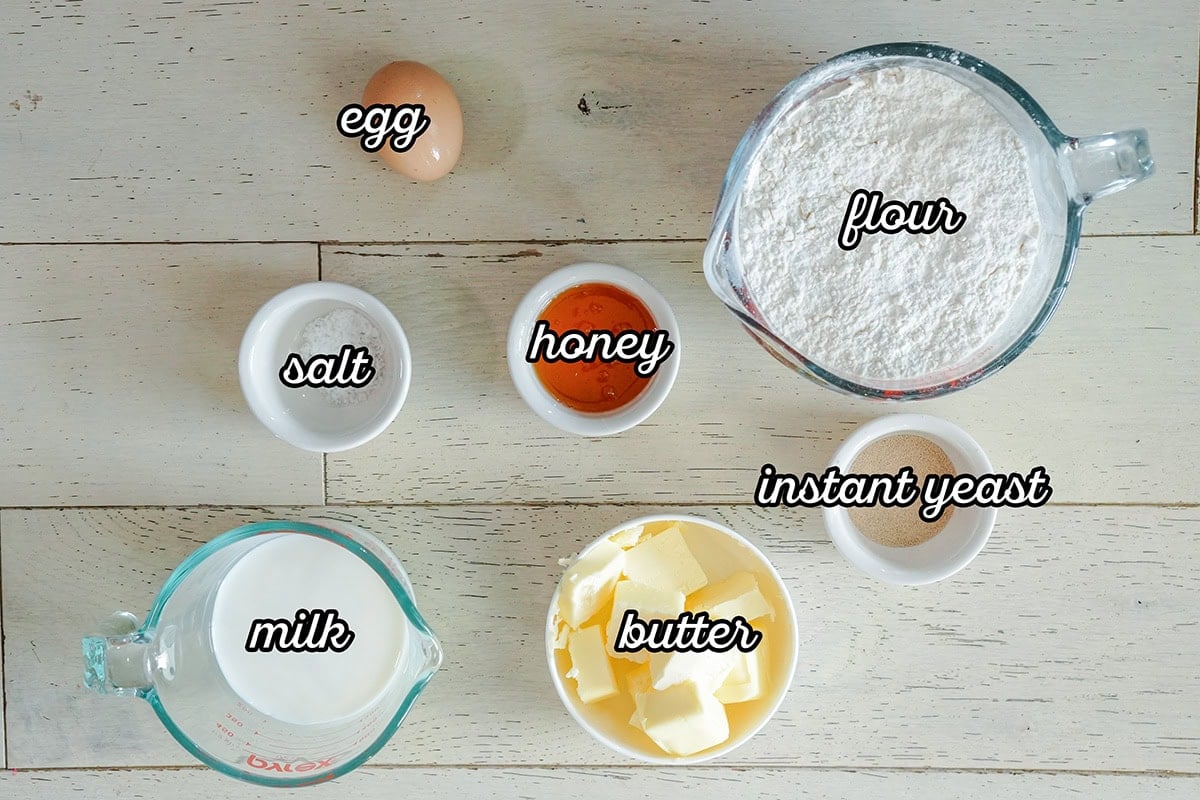 ingredients labels in bowls for making yeast rolls.