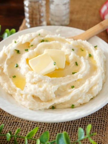 mashed potatoes with butter slices and chives.
