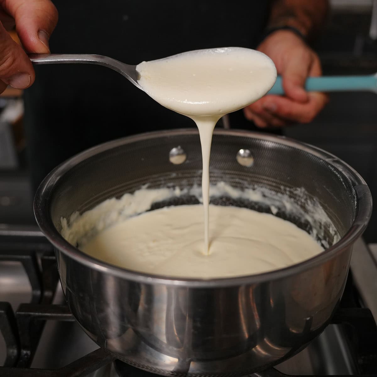 A buttery sauce in a stock pot for seasoning the potatoes.
