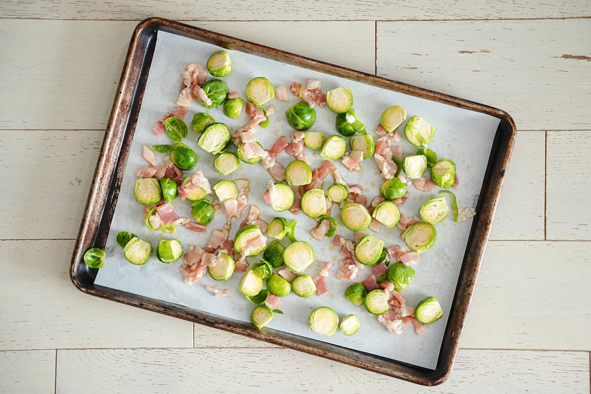 brussels sprouts on a baking sheet with parchment paper.