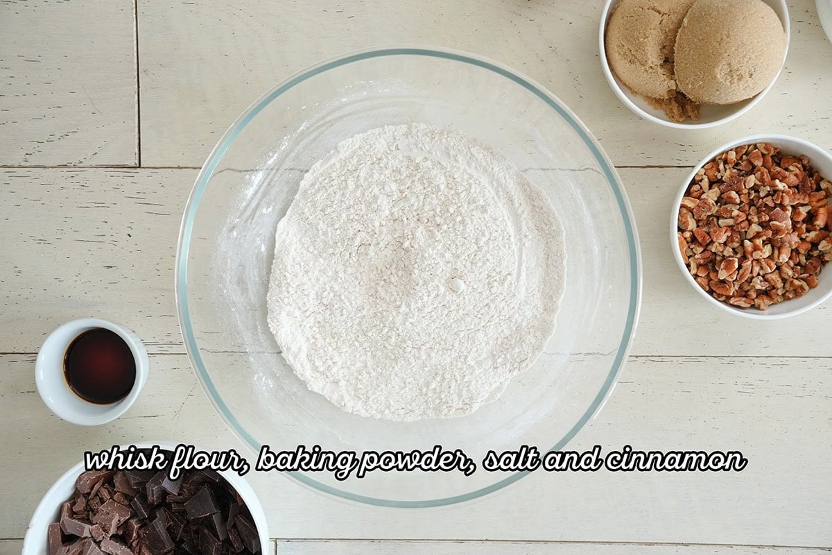 a bowl of all-purpose flour next to chocolates.