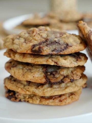 oatmeal cookies with chocolate chunks in a stack.
