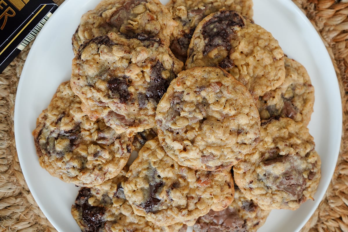 baked cookies on a plate with chocolate chunks.