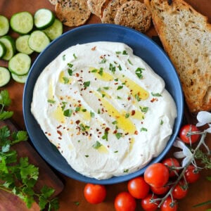 whipped feta dip served with tomatoes and cucumbers.